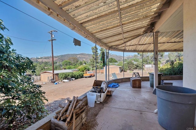 2151 Catalina Ave, Vista, CA 92084 - view of patio featuring a storage shed and a mountain view