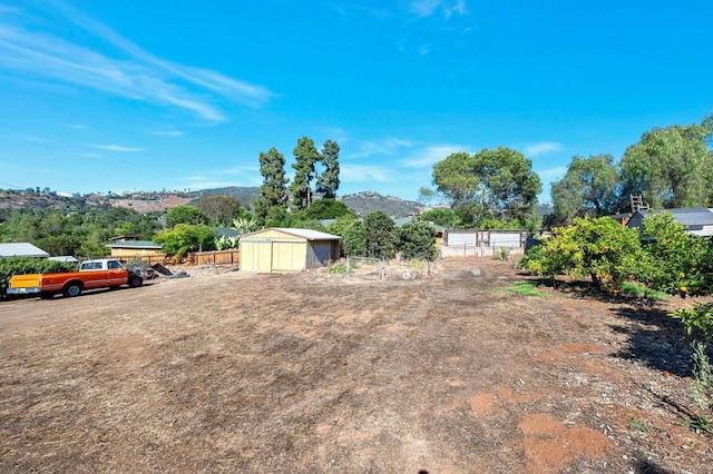 2151 Catalina Ave, Vista, CA 92084 - view of yard featuring a storage shed and a mountain view