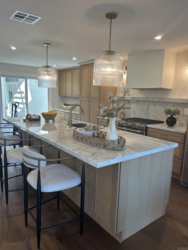 4051 Avenida Brisa, Rancho Santa Fe, CA 92091 - kitchen featuring stainless steel range with gas cooktop, dark wood finished floors, a spacious island, light stone counters, and recessed lighting