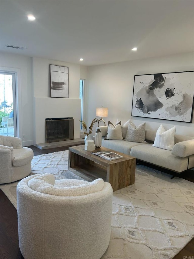 4051 Avenida Brisa, Rancho Santa Fe, CA 92091 - living area featuring a fireplace with raised hearth, recessed lighting, and wood finished floors