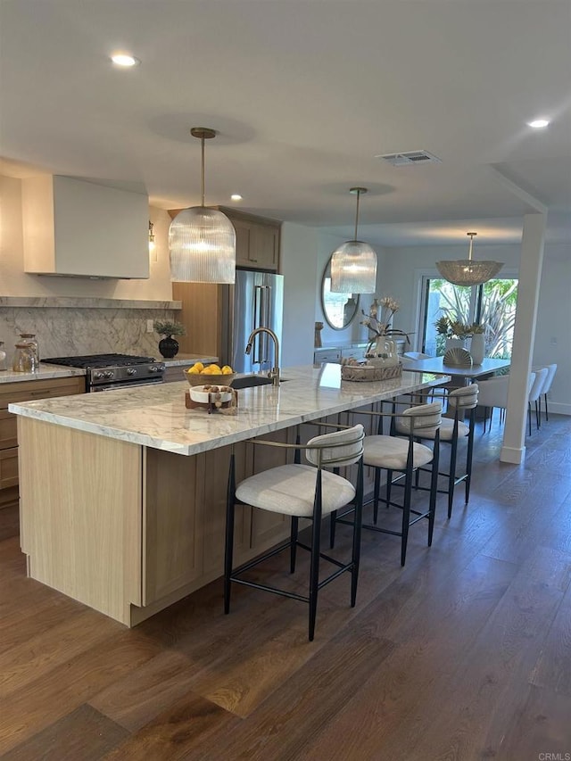 4051 Avenida Brisa, Rancho Santa Fe, CA 92091 - kitchen with appliances with stainless steel finishes, tasteful backsplash, a large island with sink, dark wood-style floors, and recessed lighting