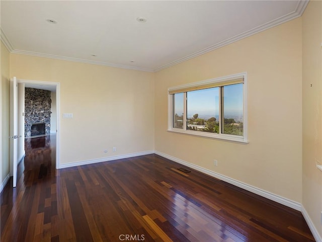 3311 Crownview Dr, Rancho Palos Verdes, CA 90275 - spare room with dark wood finished floors, crown molding, and a stone fireplace