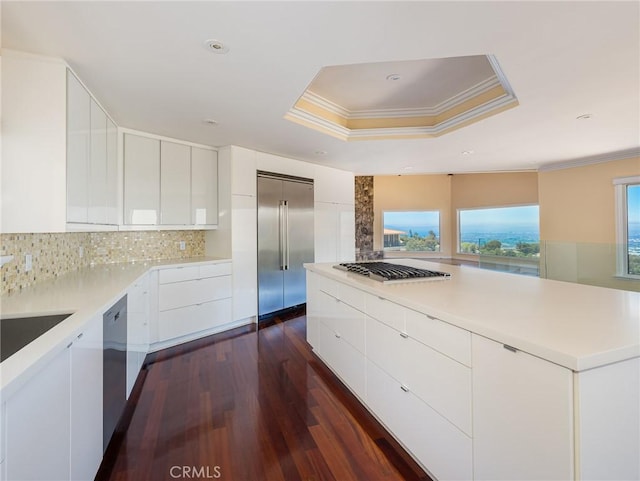 3311 Crownview Dr, Rancho Palos Verdes, CA 90275 - kitchen with stainless steel appliances, modern cabinets, dark wood-type flooring, crown molding, and white cabinets