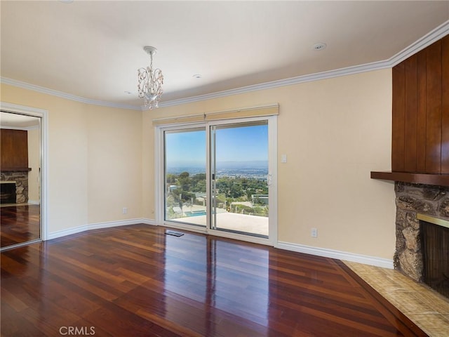 3311 Crownview Dr, Rancho Palos Verdes, CA 90275 - unfurnished living room with a stone fireplace, wood finished floors, a chandelier, and ornamental molding