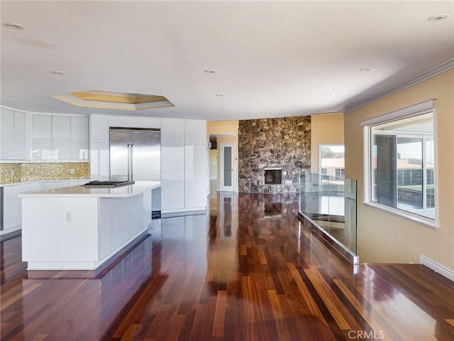 3311 Crownview Dr, Rancho Palos Verdes, CA 90275 - kitchen featuring modern cabinets, white cabinetry, appliances with stainless steel finishes, crown molding, and dark wood-style floors