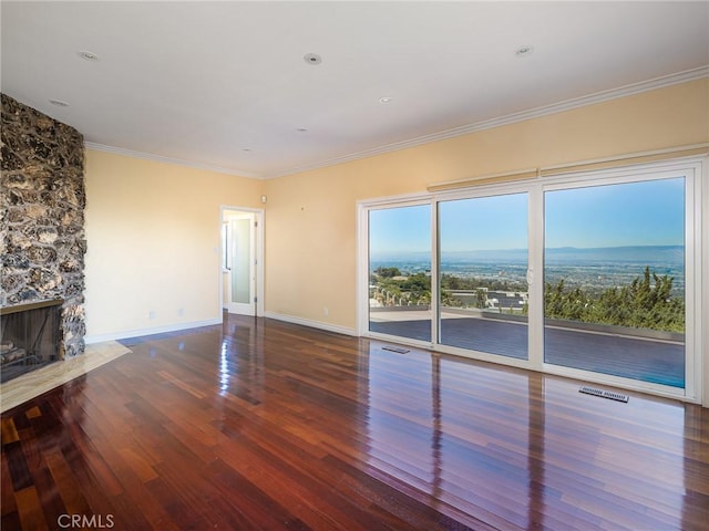 3311 Crownview Dr, Rancho Palos Verdes, CA 90275 - unfurnished living room featuring wood finished floors, a stone fireplace, and ornamental molding