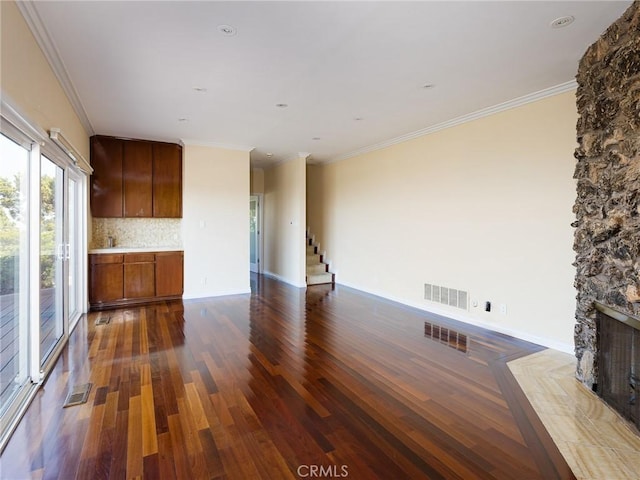 3311 Crownview Dr, Rancho Palos Verdes, CA 90275 - unfurnished living room with dark wood-style floors, a stone fireplace, stairway, and crown molding