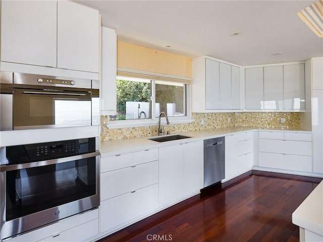 3311 Crownview Dr, Rancho Palos Verdes, CA 90275 - kitchen featuring stainless steel appliances, modern cabinets, tasteful backsplash, light countertops, and white cabinets