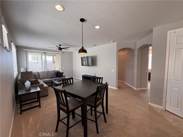 11115 Sun River Ct, Apple Valley, CA 92308 - dining room featuring arched walkways, ceiling fan, light colored carpet, a textured ceiling, and recessed lighting