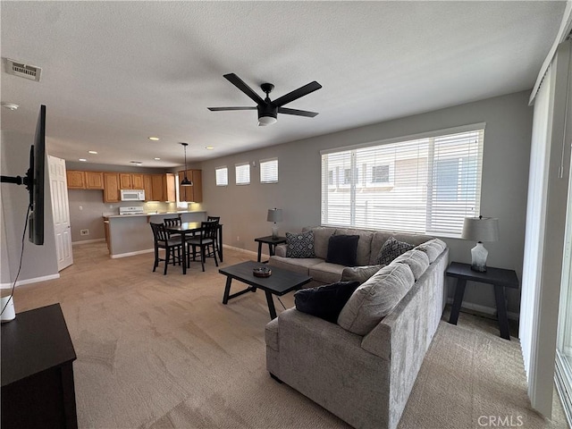 11115 Sun River Ct, Apple Valley, CA 92308 - living area with ceiling fan, light colored carpet, and recessed lighting