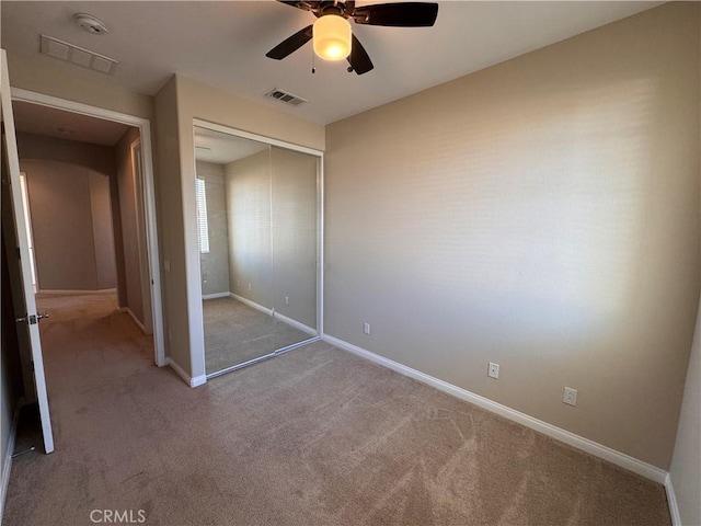 11115 Sun River Ct, Apple Valley, CA 92308 - unfurnished bedroom with carpet, a closet, and a ceiling fan