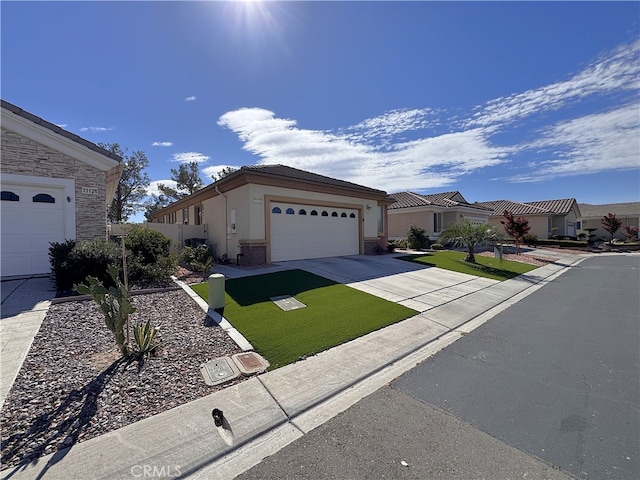 11115 Sun River Ct, Apple Valley, CA 92308 - ranch-style house featuring driveway, an attached garage, stucco siding, and a front yard