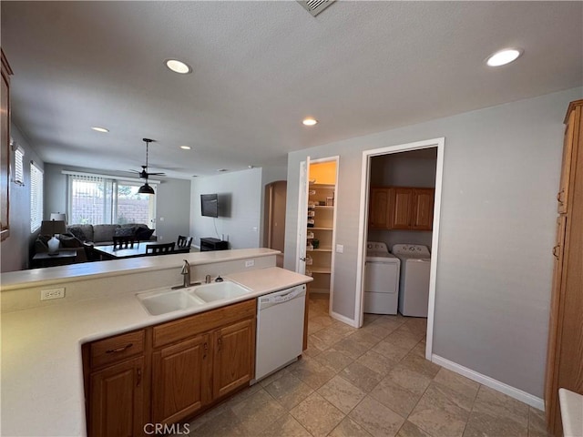 11115 Sun River Ct, Apple Valley, CA 92308 - kitchen with dishwasher, washer and clothes dryer, open floor plan, a ceiling fan, and light countertops