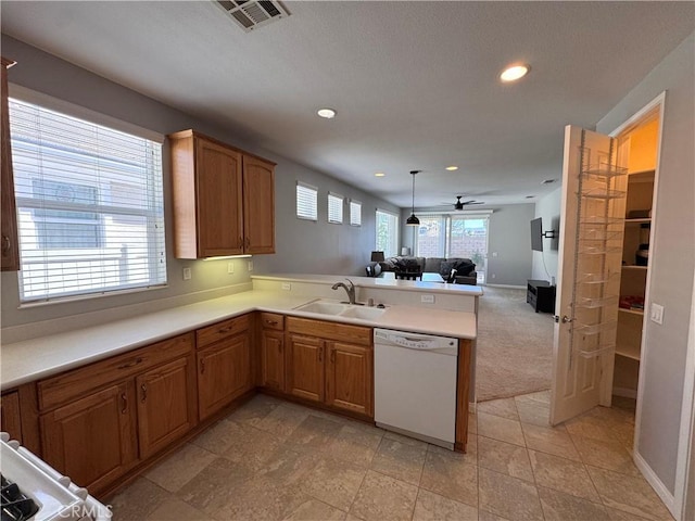 11115 Sun River Ct, Apple Valley, CA 92308 - kitchen featuring dishwasher, open floor plan, a peninsula, recessed lighting, and light countertops