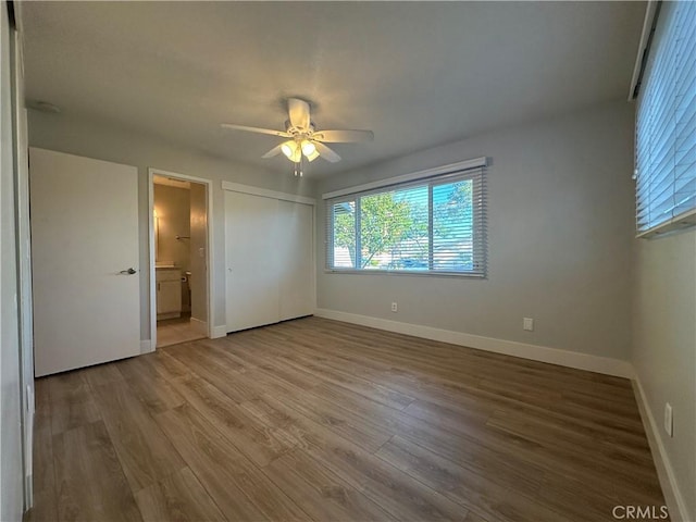 16415 Red Coach Ln, Whittier, CA 90604 - unfurnished bedroom with a closet, wood finished floors, ensuite bath, and a ceiling fan