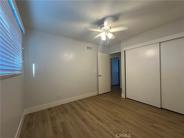 16415 Red Coach Ln, Whittier, CA 90604 - unfurnished bedroom with wood finished floors, a closet, and a ceiling fan