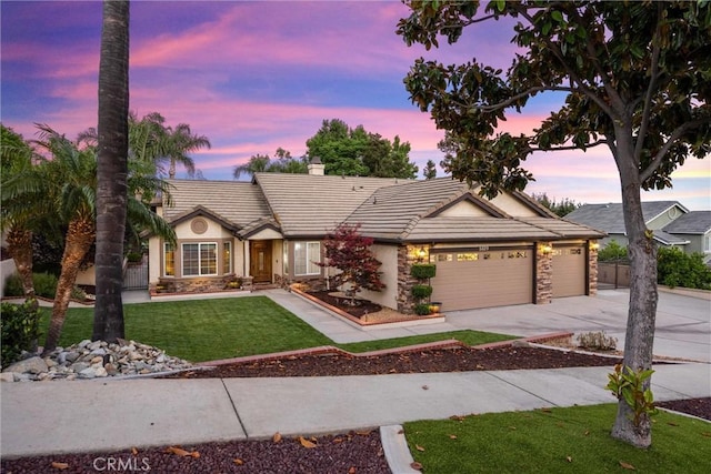 5829 Zapata Pl, Rancho Cucamonga, CA 91737 - single story home with stone siding, a tile roof, a garage, concrete driveway, and a chimney