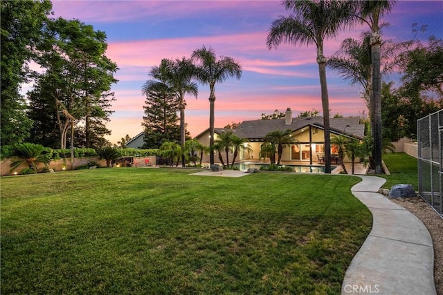 5829 Zapata Pl, Rancho Cucamonga, CA 91737 - yard at dusk with a patio and an outdoor pool