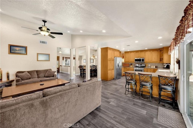 5829 Zapata Pl, Rancho Cucamonga, CA 91737 - living area with recessed lighting, a textured ceiling, dark wood-style flooring, ceiling fan, and lofted ceiling