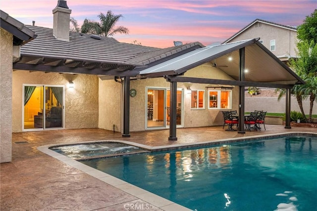 5829 Zapata Pl, Rancho Cucamonga, CA 91737 - back of property with stucco siding, a tiled roof, a pool with connected hot tub, and a patio area