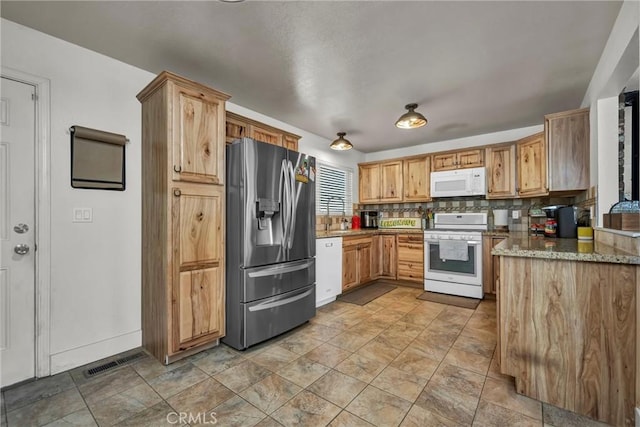 20511 Santa Barbara Ave, Middletown, CA 95461 - kitchen with white appliances, stone finish floors, and stone counters