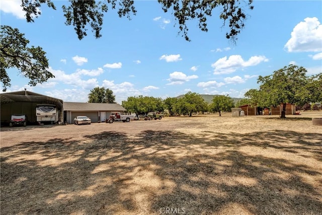 20511 Santa Barbara Ave, Middletown, CA 95461 - view of yard featuring a detached carport and a garage