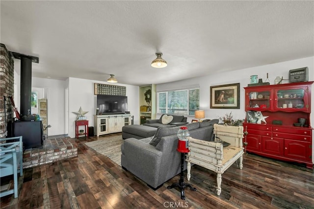 20511 Santa Barbara Ave, Middletown, CA 95461 - living area with a wood stove, wood finished floors, and a textured ceiling