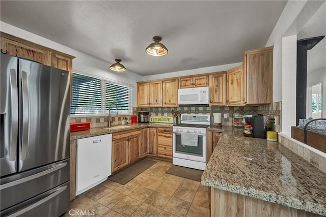 20511 Santa Barbara Ave, Middletown, CA 95461 - kitchen with white appliances, decorative backsplash, and light stone countertops