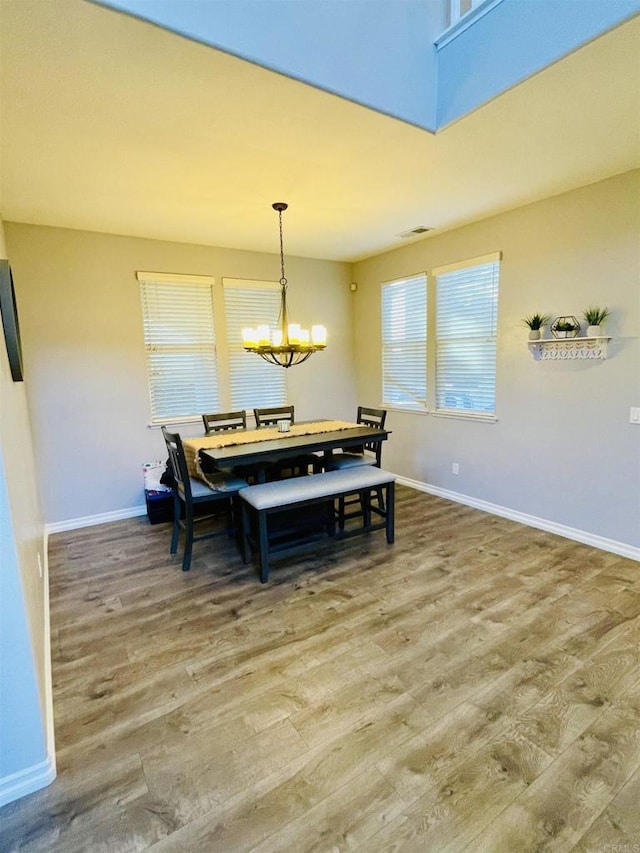 1546 Quiet Trail Dr, Chula Vista, CA 91915 - dining space featuring wood finished floors and a chandelier