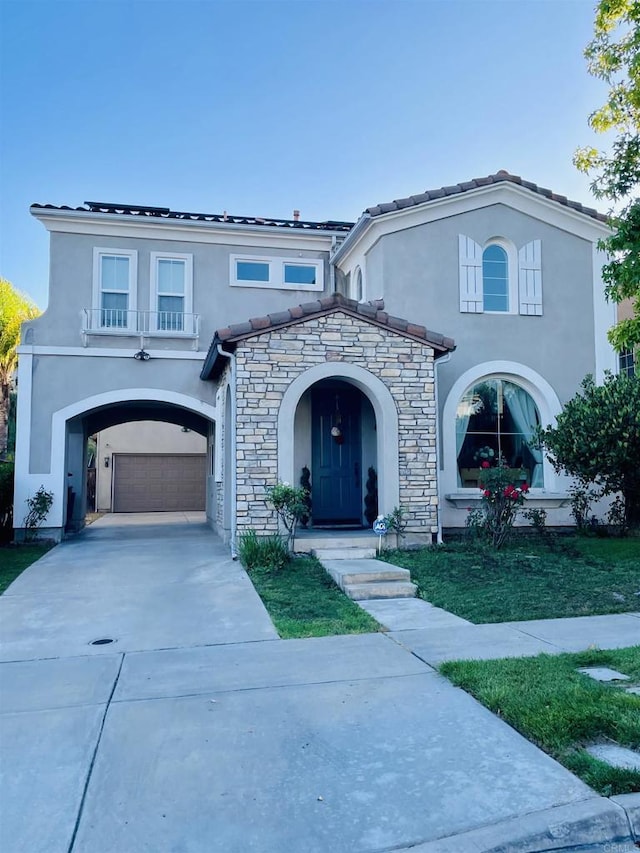 1546 Quiet Trail Dr, Chula Vista, CA 91915 - mediterranean / spanish home featuring stucco siding, concrete driveway, stone siding, and an attached garage