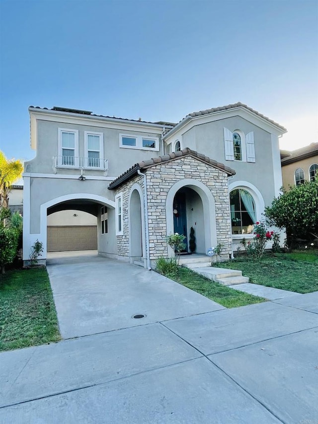 1546 Quiet Trail Dr, Chula Vista, CA 91915 - mediterranean / spanish house with driveway, stucco siding, stone siding, and a garage