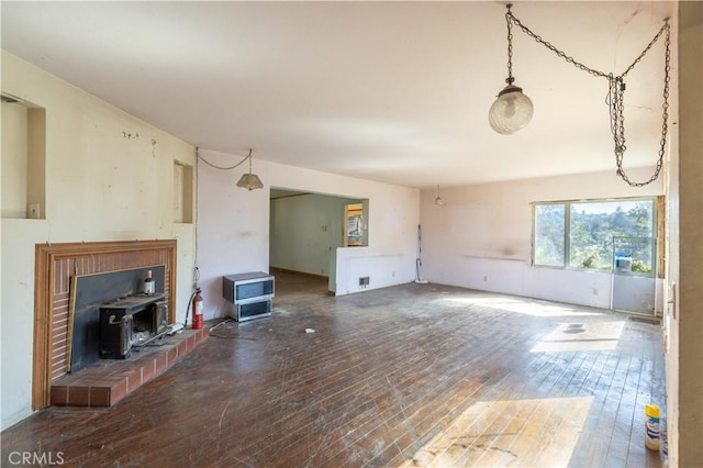 3142 Keith Ave, Castro Valley, CA 94546 - unfurnished living room with a wood stove and hardwood / wood-style floors