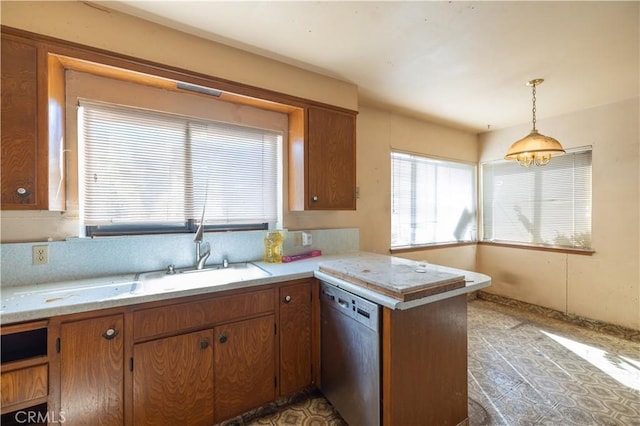 3142 Keith Ave, Castro Valley, CA 94546 - kitchen with stainless steel dishwasher, healthy amount of natural light, a peninsula, and light countertops