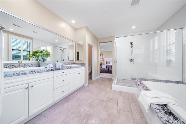 111 Spoke, Irvine, CA 92618 - bathroom with a stall shower, double vanity, a bath, connected bathroom, and recessed lighting