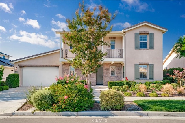 111 Spoke, Irvine, CA 92618 - view of front of home featuring a balcony, stucco siding, driveway, and a garage