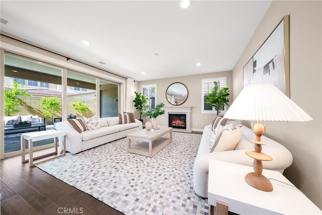 111 Spoke, Irvine, CA 92618 - living room with wood finished floors, a glass covered fireplace, and recessed lighting