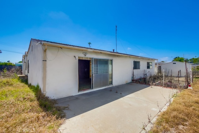 1361 Monterey Ct, Chula Vista, CA 91911 - back of house with stucco siding and a patio area