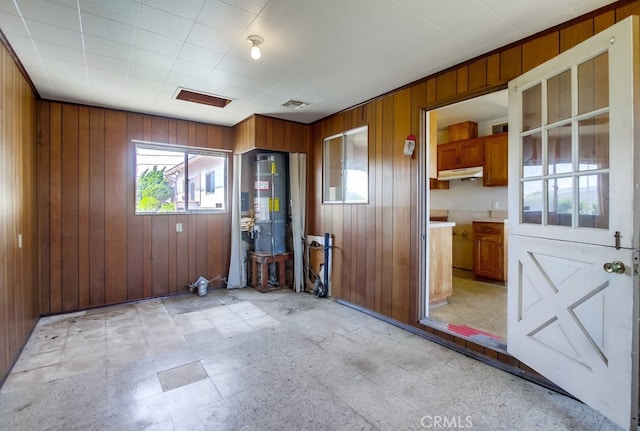 1361 Monterey Ct, Chula Vista, CA 91911 - unfurnished room featuring wood walls, secured water heater, and light flooring