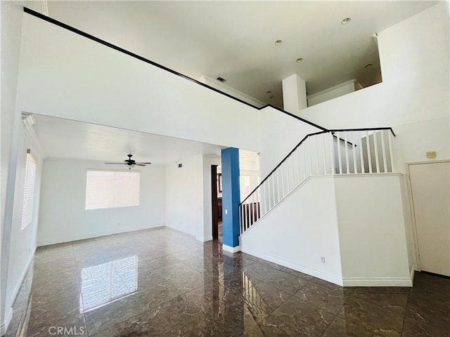 405 E Lurelane St, Rialto, CA 92376 - unfurnished living room with stairway, ceiling fan, and a high ceiling