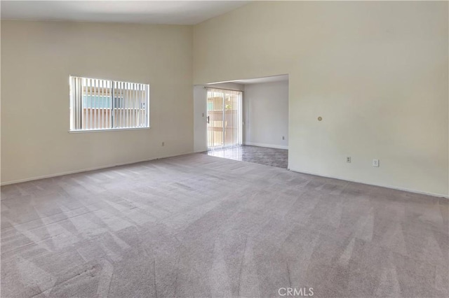 26441 Paseo Carmel Unit 8E, San Juan Capistrano, CA 92675 - carpeted spare room with a towering ceiling and baseboards