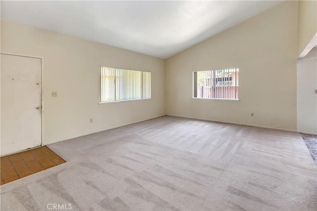 26441 Paseo Carmel Unit 8E, San Juan Capistrano, CA 92675 - empty room with carpet flooring and vaulted ceiling