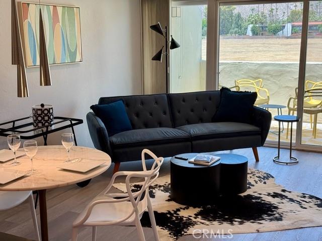 1655 E Palm Canyon Dr Unit 308, Palm Springs, CA 92264 - living area with wood finished floors