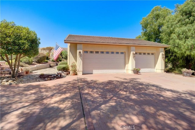 670 Highland Hills Rd, Nipomo, CA 93444 - view of front of property featuring concrete driveway and stucco siding