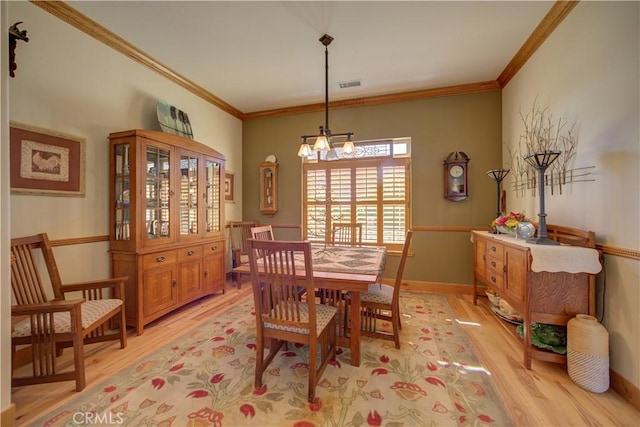 670 Highland Hills Rd, Nipomo, CA 93444 - dining room featuring light wood-style floors, a chandelier, and crown molding