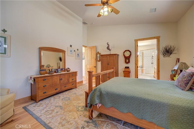 670 Highland Hills Rd, Nipomo, CA 93444 - bedroom with light wood-type flooring, vaulted ceiling, connected bathroom, and ceiling fan