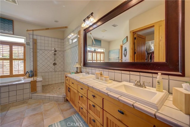 670 Highland Hills Rd, Nipomo, CA 93444 - bathroom with double vanity, a tile shower, a bath, and tile patterned flooring