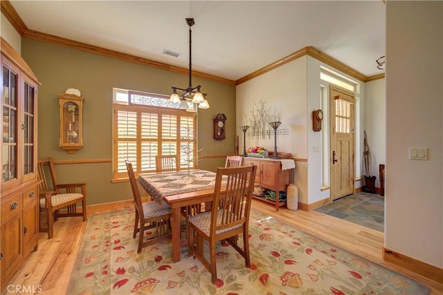 670 Highland Hills Rd, Nipomo, CA 93444 - dining area with light wood-style flooring, ornamental molding, and a chandelier