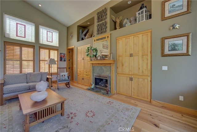 670 Highland Hills Rd, Nipomo, CA 93444 - living room with high vaulted ceiling, a premium fireplace, and light wood finished floors