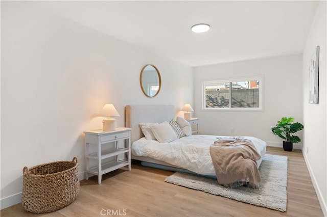 1825 W Carlton Pl, Santa Ana, CA 92704 - bedroom featuring wood finished floors and baseboards