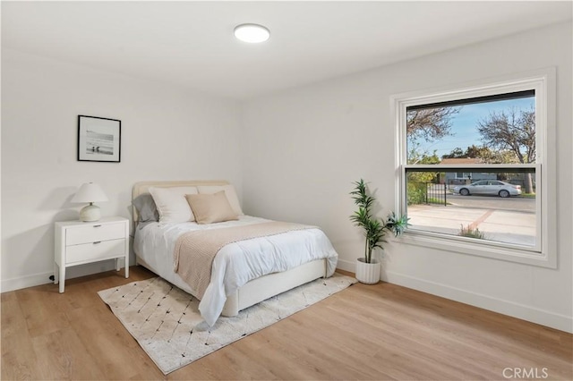 1825 W Carlton Pl, Santa Ana, CA 92704 - bedroom with baseboards and light wood-type flooring